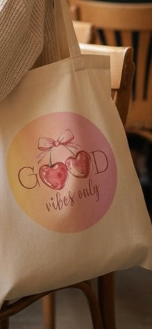 Cotten white tote bag with a good vibe design