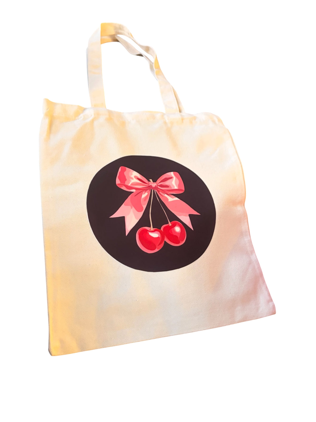 White tote bag with black and pink cherry design