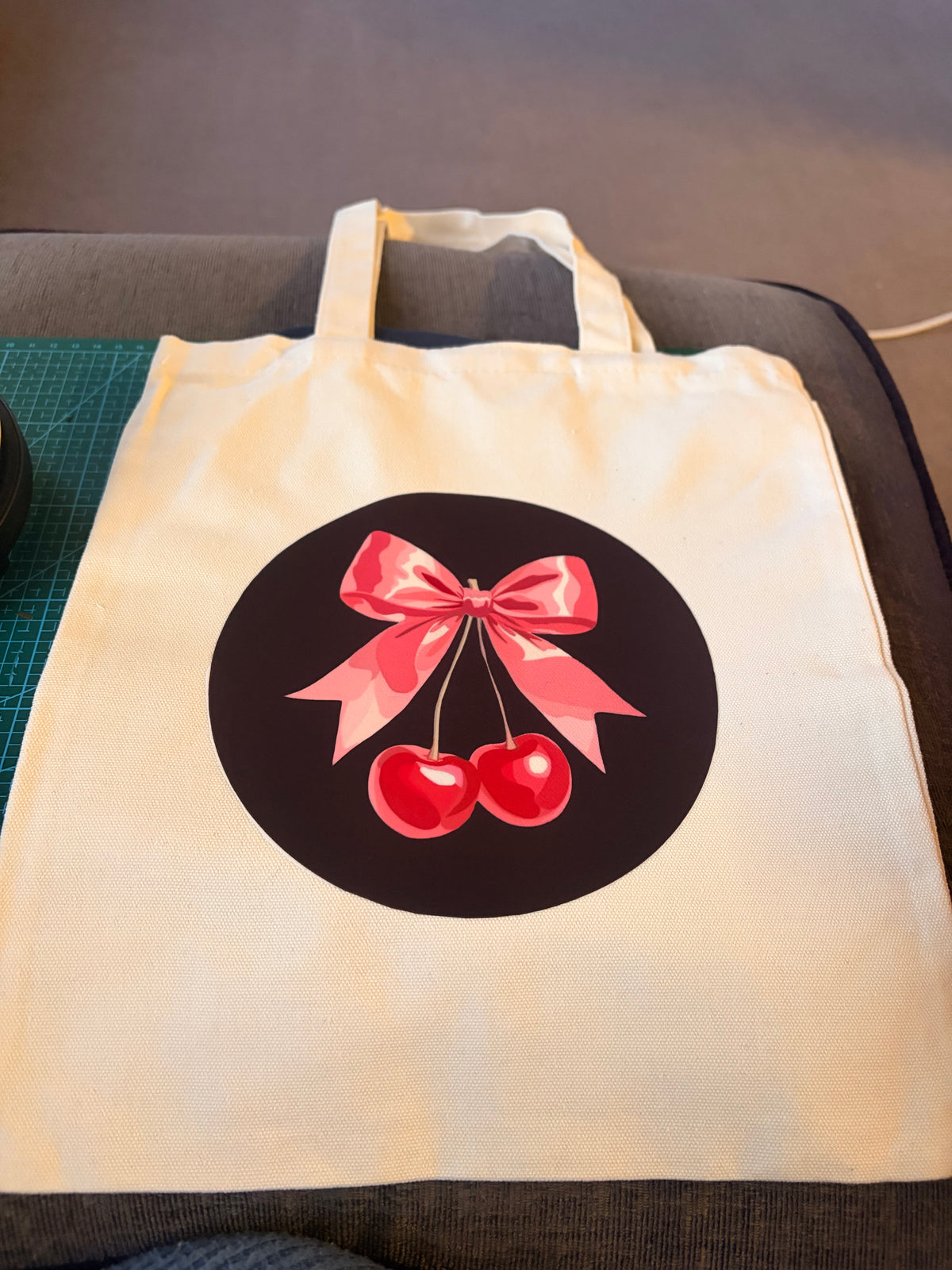 White tote bag with black and pink cherry design